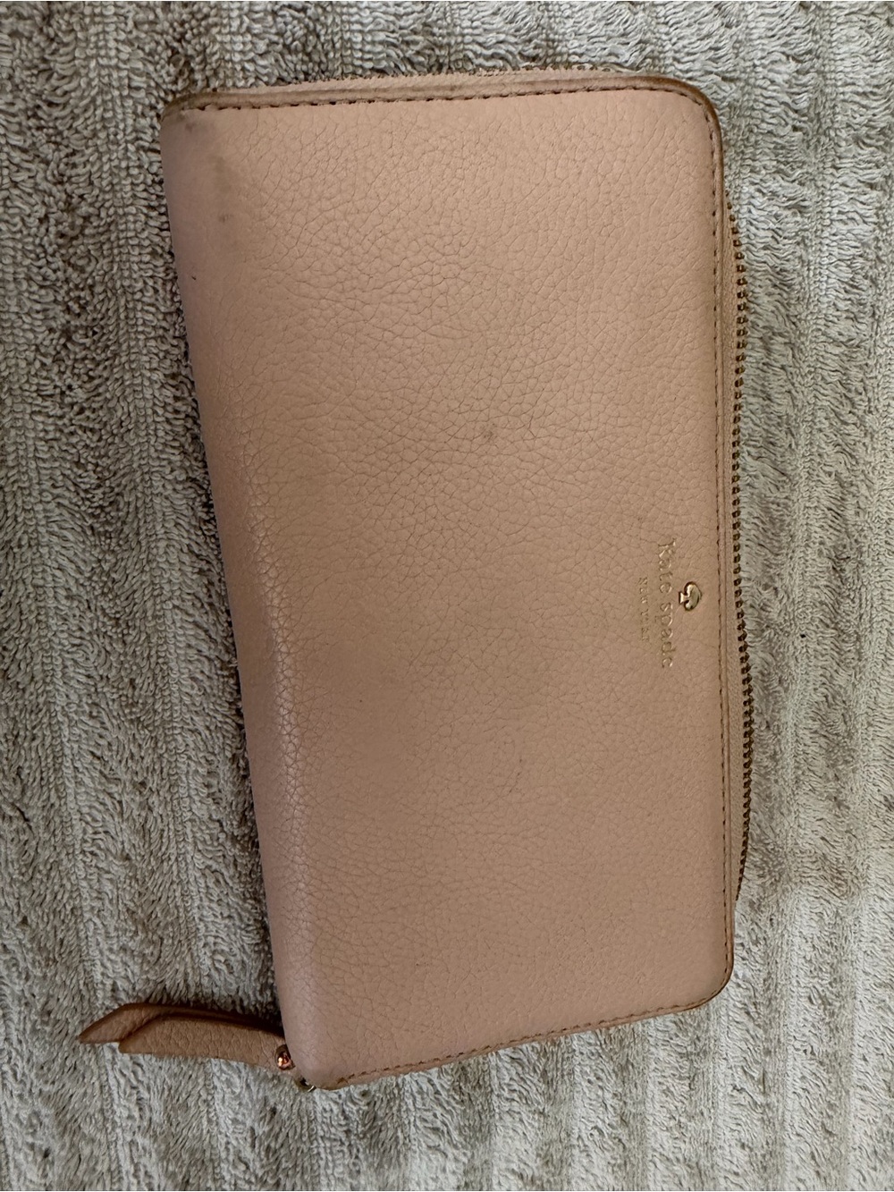kate spade Pebbled Blush Leather Zip Wallet with Gold Logo-wear on the outside